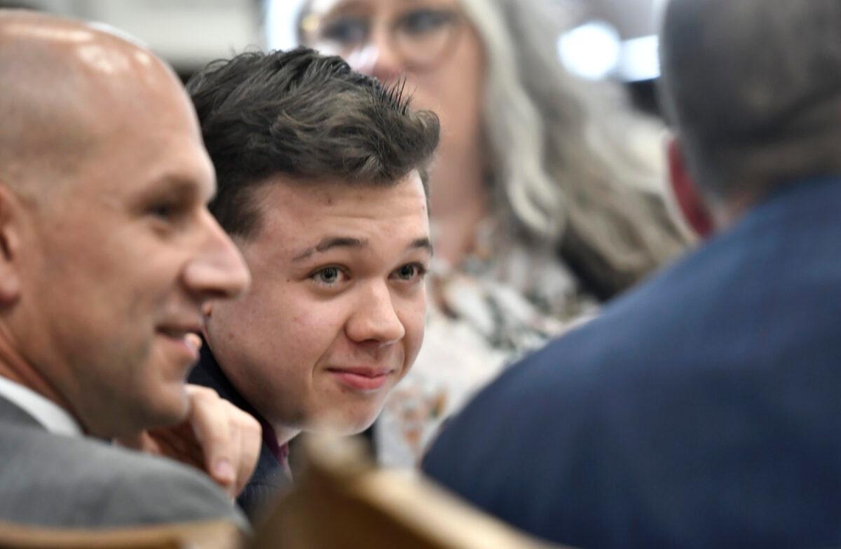 Kyle Rittenhouse talks with his legal team before his side gives opening statements to the jury during his trial at the Kenosha County Courthouse in Kenosha, Wis., on Nov. 2, 2021. (Sean Krajacic/Pool/Getty Images)