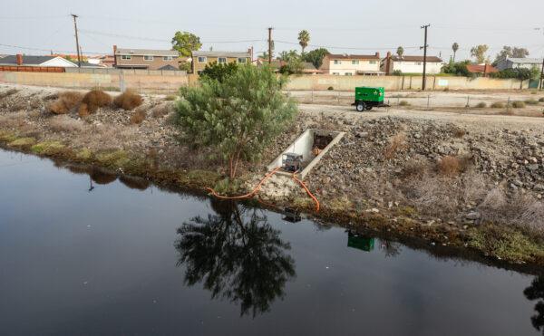 Treatment is underway for the Dominguez Channel as residents have been experiencing a foul odor from the water in Carson, Calif., on Nov. 4, 2021. (John Fredricks/The Epoch Times)