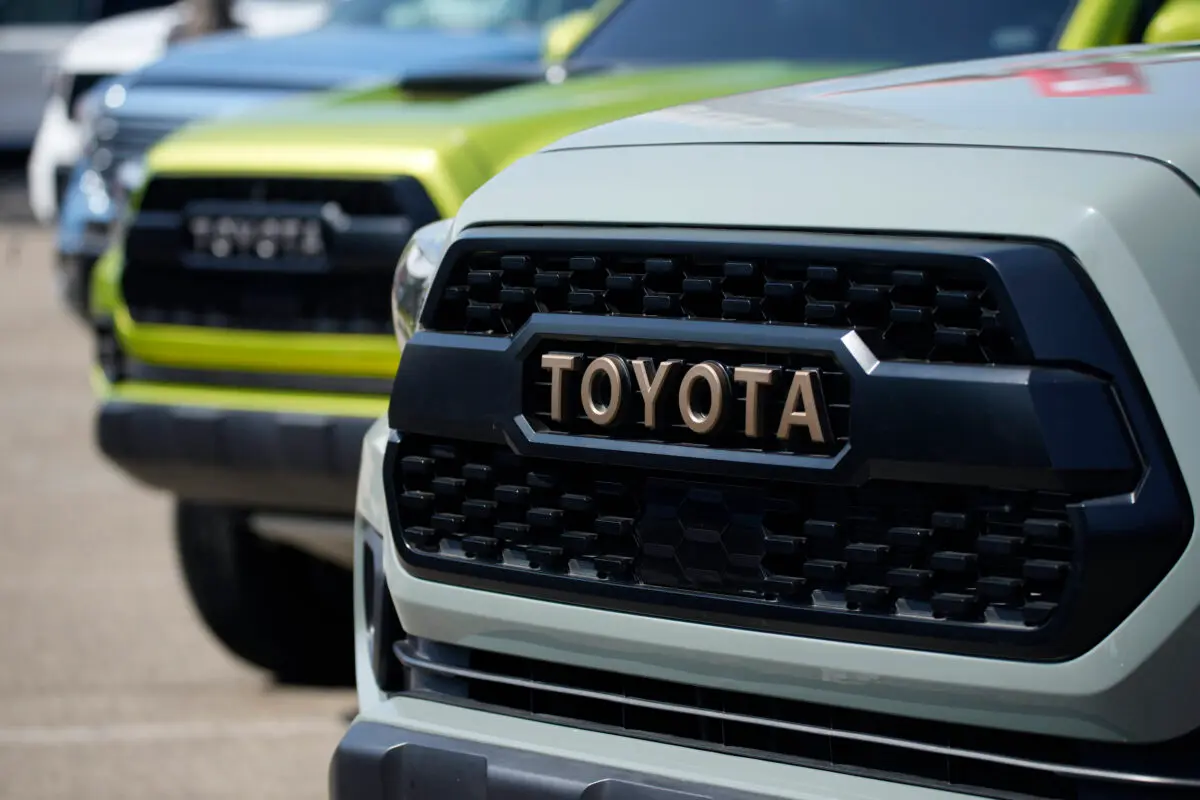 The Toyota logo highlights the grille of a Tacoma pickup truck on display in the Toyota exhibit at the Denver auto show at Elitch’s Gardens in downtown Denver on Sept. 17, 2021. (David Zalubowski/AP Photo)