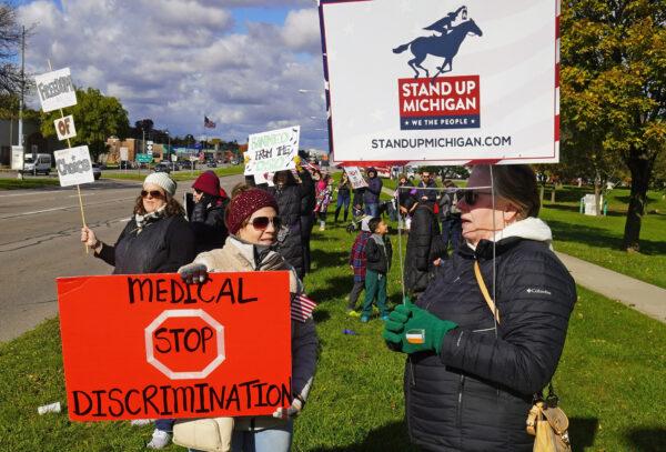 A coalition of grassroots citizens' groups came together to protest vaccination mandates and government overreach in Royal Oak, Mich., on Nov. 3, 2021 (Steven Kovac/The Epoch Times)