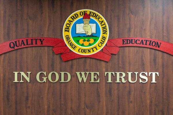 "In God We Trust" hangs in the meeting area of the Orange County Board of Education in Costa Mesa, Calif., on Oct. 7, 2020. (John Fredricks/The Epoch Times)