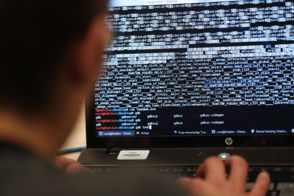 An engineering student takes part in a hacking challenge near Paris on March 16, 2013. (Thomas Samson/AFP via Getty Images)