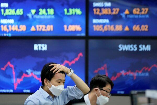 A currency trader gestures at a foreign exchange dealing room in Seoul, South Korea on Nov. 4, 2021. (Lee Jin-man/AP Photo)