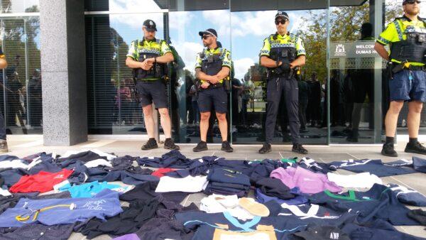 Health staff leave their uniforms in protest over Western Australia's vaccine mandates outside of Dumas House, the residence of WA Premier Mark McGowan, in Perth, Australia on Nov. 1, 2021. All hospital staff must receive their first vaccination by Nov. 1 to keep working, part of sweeping mandates that will require 75 percent of the state's workforce to be vaccinated by January, 2022. (The Epoch Times)