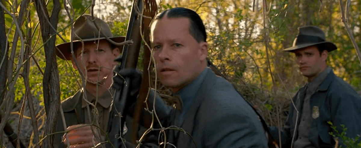 Special agent Charlie Rakes (Guy Pearce, center) out to apprehend illegal bootleggers, in "Lawless." (Richard Foreman/The Weinstein Company)
