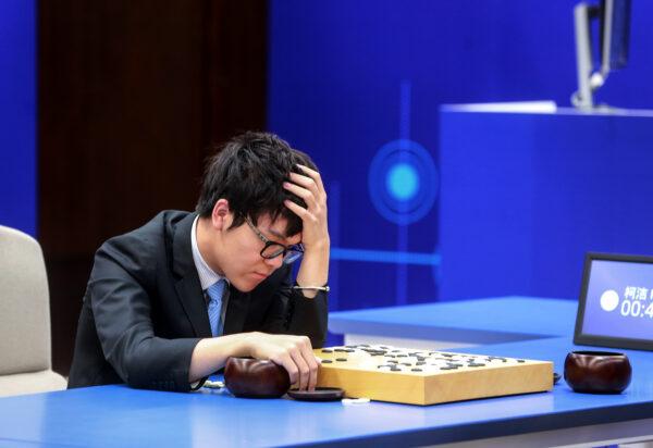 China's 19-year-old Go player Ke Jie reacts during the second match against Google's artificial intelligence programme AlphaGo in Wuzhen, eastern China's Zhejiang province on May 25, 2017. (STR/AFP via Getty Images)
