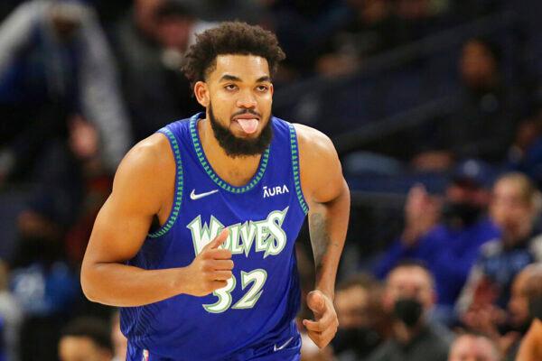 Minnesota Timberwolves center Karl-Anthony Towns reacts after making a 3-point basket against the Los Angeles Clippers during the first half of an NBA basketball game in Minneapolis, Minn., on Nov. 5, 2021. (Andy Clayton-King/AP Photo)