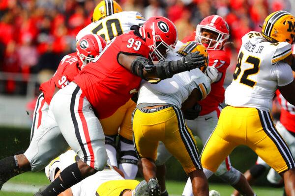 Georgia defensive lineman Jordan Davis levels Missouri running back Tyler Badie behind the line of scrimmage for a loss during the second half of an NCAA college football game in Athens, Ga., on Nov. 6, 2021. (Curtis Compton/Atlanta Journal-Constitution via AP)