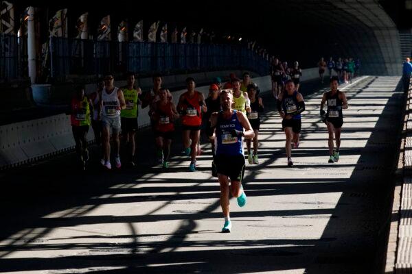 Runners cross the Queensboro Bridge during the New York City Marathon in New York on Nov. 7, 2021. (Eduardo Munoz Alvarez/AP Photo)