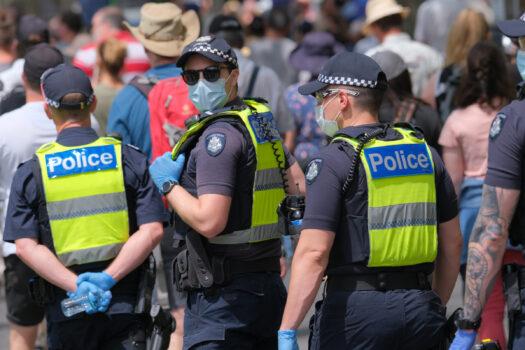 Police monitor Australians are protesting against government-mandated health restrictions, increasing powers, and the Pandemic Bill in Melbourne, Australia, on Nov. 6, 2021. (Supplied)