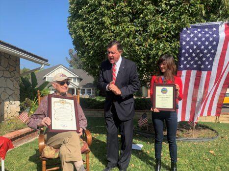 Orange County Supervisor Don Wagner (C) issues a proclamation on James Bradley's (L) 100th birthday, in Yorba Linda, Calif., on Nov. 5, 2021. (Linda Jiang/The Epoch Times)