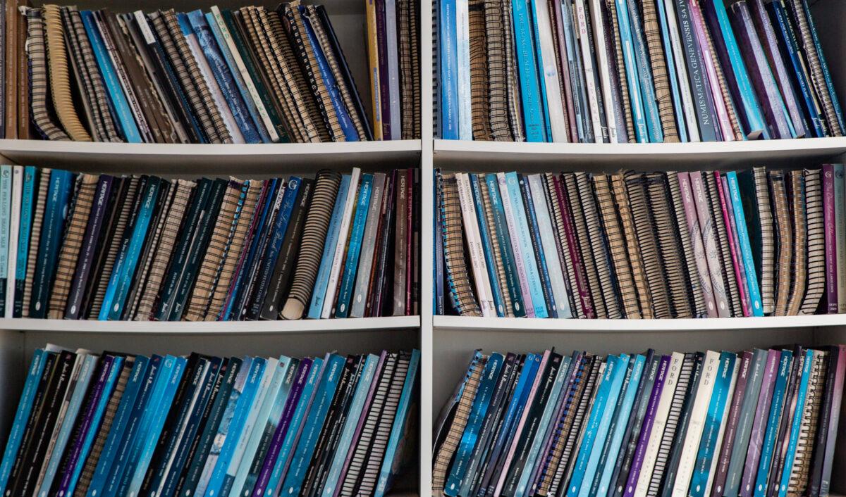 A library of coin catalogs sits in the conference room of Rare Coin Wholesalers offices in Irvine, Calif., on Oct. 19, 2021. (John Fredricks/The Epoch Times)