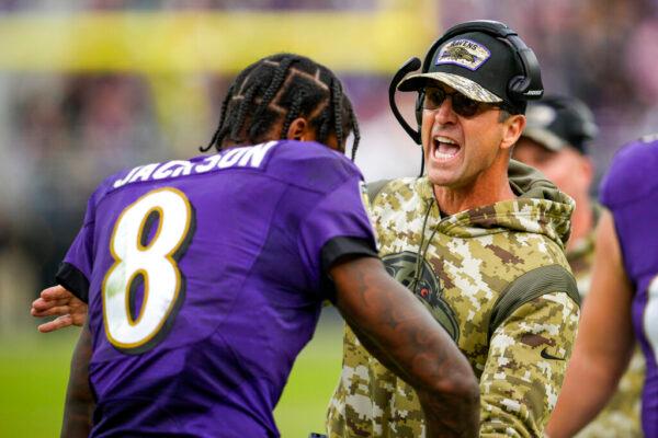 Baltimore Ravens quarterback Lamar Jackson (8) celebrates a touchdown pass with head coach John Harbaugh during the second half of an NFL football game against the Minnesota Vikings in Baltimore, on Nov. 7, 2021. (Nick Wass/AP Photo)