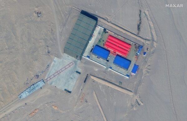 A satellite picture shows a rail terminus and target storage building in Ruoqiang, Xinjiang Province, China, on Oct. 7, 2021. (Satellite Image ©2021 Maxar Technologies/Handout via Reuters)