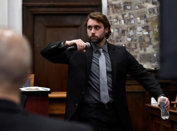 Gaige Grosskreutz demonstrates how he was standing when he was shot by Kyle Rittenhouse on Aug. 25, 2020, during Rittenhouse's trial at the Kenosha County Courthouse in Kenosha, Wis., U.S. on Monday, Nov. 8, 2021. (Sean Krajacic/Pool via REUTERS)