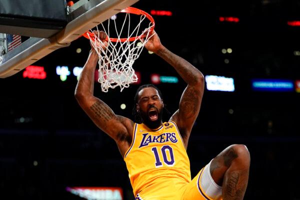 Los Angeles Lakers center DeAndre Jordan dunks the ball during the first half of an NBA basketball game against the Charlotte Hornets in Los Angeles, on Nov. 8, 2021. (Ashley Landis/AP Photo)