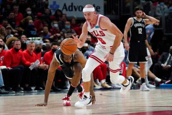 Chicago Bulls' Alex Caruso (6) steals the ball from Brooklyn Nets' James Harden during the second half of an NBA basketball game in Chicago on Nov. 8, 2021. (Charles Rex Arbogast/AP Photo)
