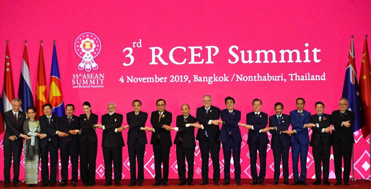 (From L to R) Prime ministers, state counselors, premiers, and trade ministers or secretaries from Singapore, Laos, Cambodia, New Zealand, India, China, Thailand, Vietnam, Australia, Japan, South Korea, Brunei, Indonesia, Malaysia, and the Philippines pose for a group photo during the 3rd Regional Comprehensive Economic Partnership (RCEP) Summit in Bangkok, Thailand, on Nov. 4, 2019. (Manan Vatsyayana/AFP via Getty Images)