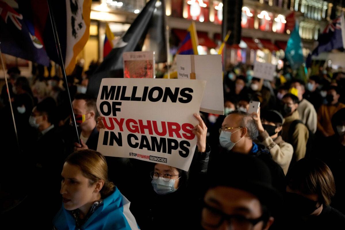 Demonstrators supporting Tibetans, Uyghurs, and Hongkongers take part in a protest against the Chinese Communist Party as they march along Regent Street toward the Chinese Embassy in London, UK, on Oct. 1, 2021. (Matt Dunham/AP Photo)