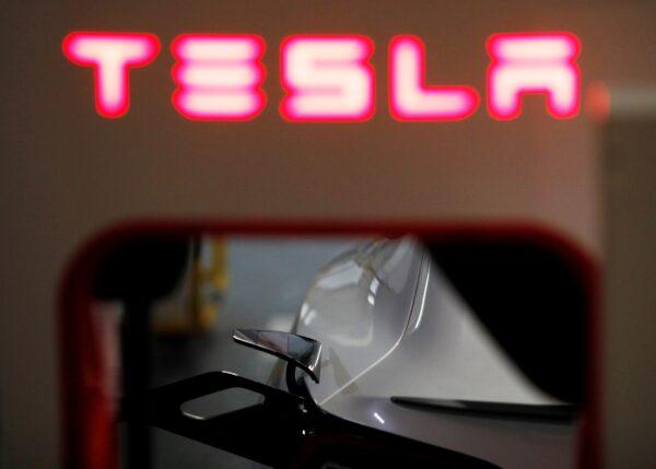 A Tesla car charges at a Supercharger station in Singapore on Oct. 22, 2021. (Edgar Su/Reuters)