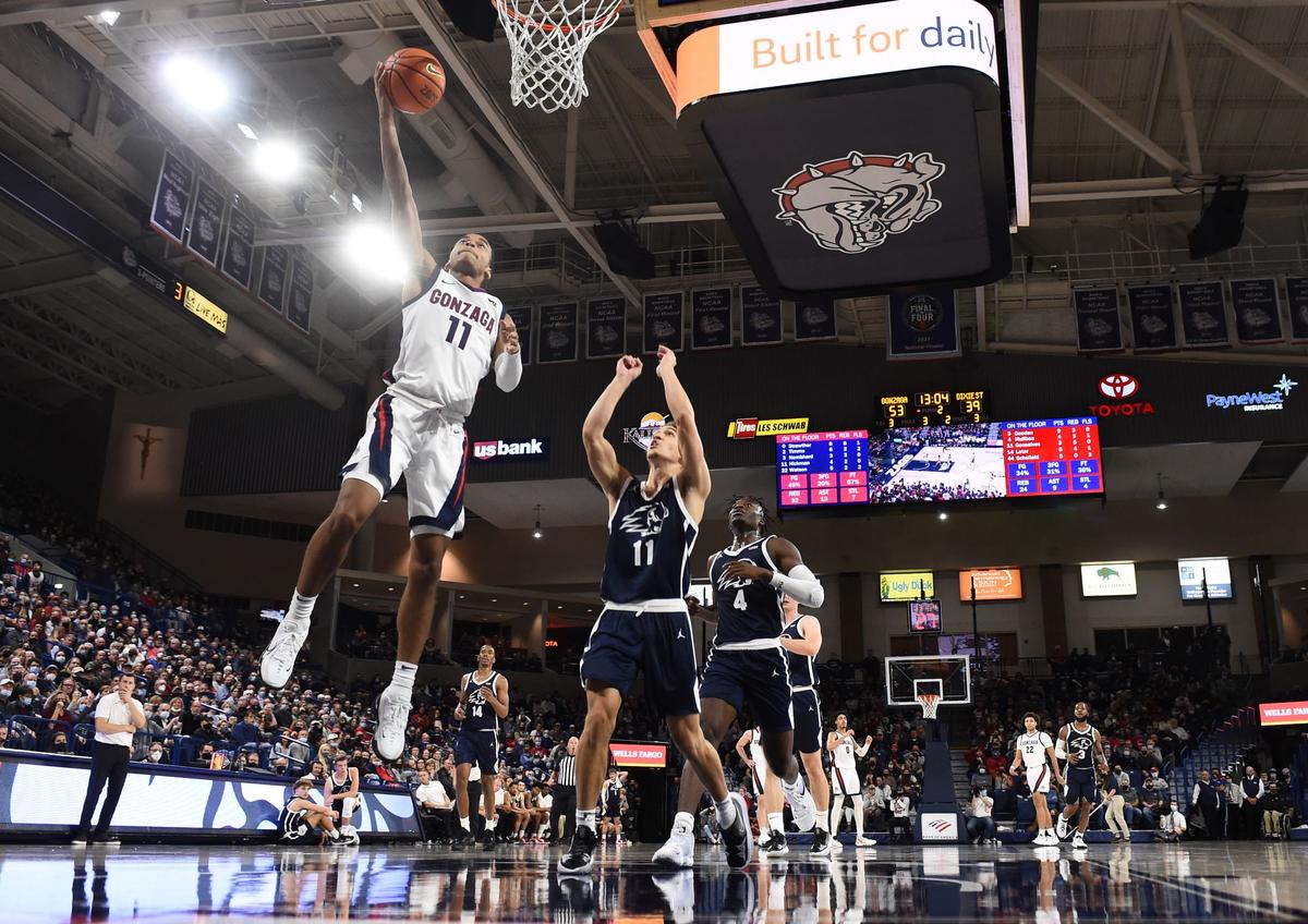 Gonzaga Bulldogs guard Nolan Hickman, (L), gets by Dixie State Trailblazers guard Noa Gonsalves (11) for a basket in the second half at McCarthey Athletic Center in Spokane, Wash., on Nov. 9, 2021. (James Snook-USA TODAY Sports via Reuters)
