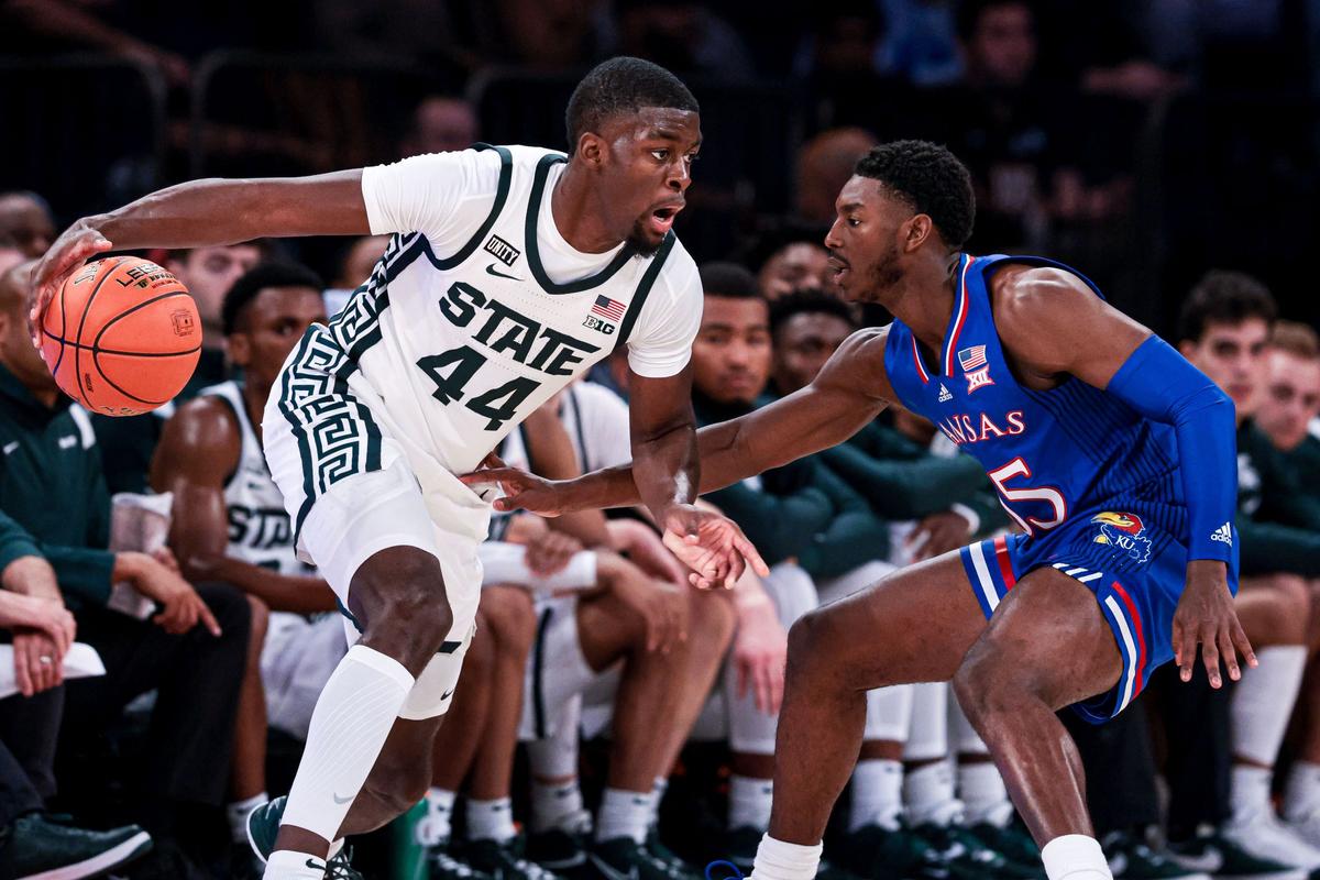 Michigan State Spartans forward Gabe Brown (44) dribbles as Kansas Jayhawks guard Jalen Coleman-Lands (55) defends during the second half at Madison Square Garden in New York, on Nov. 9, 2021. (Vincent Carchietta-USA TODAY Sports via Reuters)