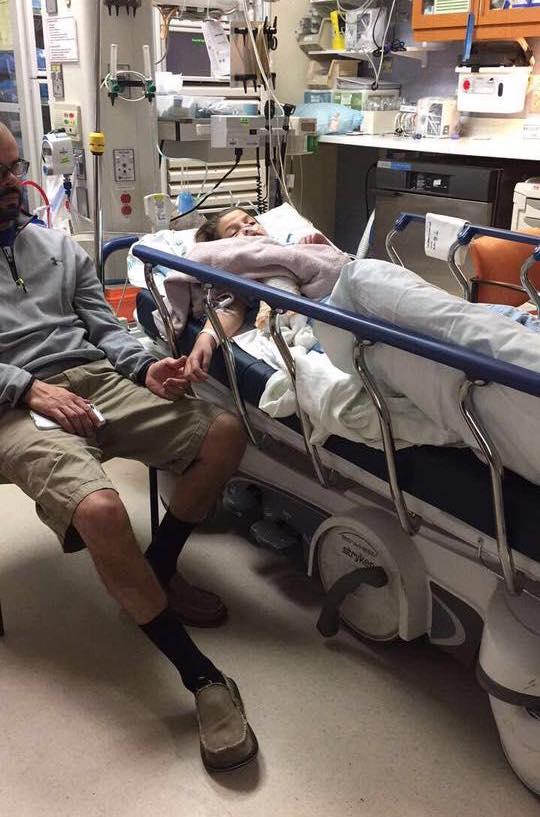Gerardo Bentos-Pereira holding his daughter Natalie's hand in the hospital. (Courtesy of <a href="https://www.facebook.com/profile.php?id=100063586202141">Margaret Bentos-Pereira</a>)