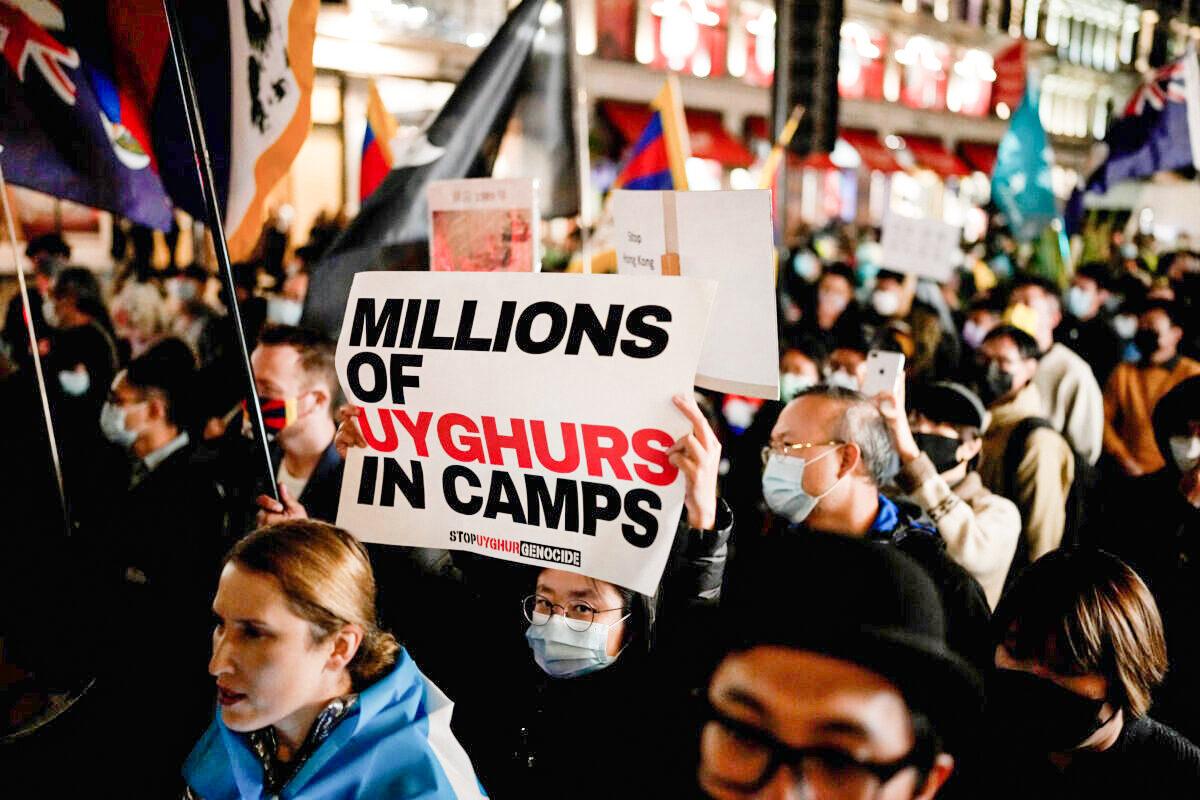 Demonstrators supporting Tibetans, Uyghurs, and Hongkongers take part in a protest against the Chinese Communist Party as they march along Regent Street toward the Chinese Embassy in London, on Oct. 1, 2021. (Matt Dunham/AP Photo)