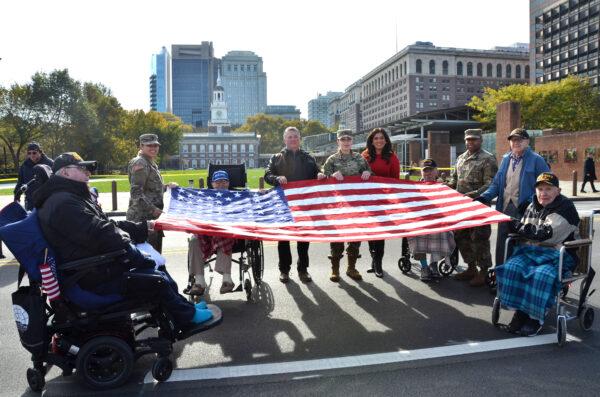 Veterans display a big United States national flag at Independence Mall for the 7th Annual Veterans Parade in Philadelphia, Pa., on Nov. 7, 2021. (Frank Liang/The Epoch Times)