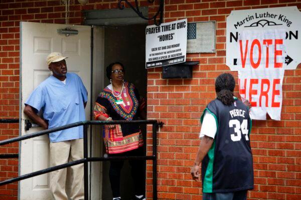 Poll station workers wait for voters at the Martin Luther King Nutrition Center during the presidential primary in Selma, Alabama on March 3, 2020. (Joshua Lott/AFP via Getty Images)
