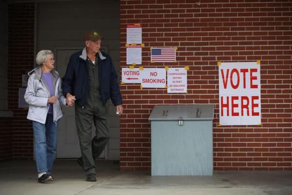 Voters exit after casting their ballots at a polling station setup in the fire department at Gallant, Alabama on Dec.12, 2017. (Joe Raedle/Getty Images)