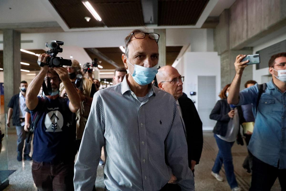 Shmulik Peleg, grandfather of Eitan Biran, who survived a cable car crash in Italy that killed his immediate family, arrives at court in Tel Aviv, on Nov. 11, 2021. (AP Photo/Ariel Schalit)