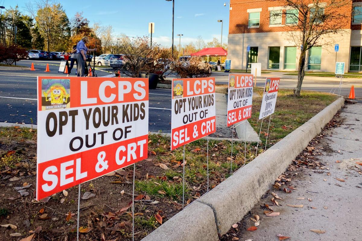 Signs against Critical Theory in front of the Loudoun County School Administration building on Nov. 9, 2021. (Terri Wu/The Epoch Times)