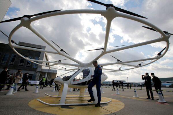 A pilot gets off a "Volocopter 2X" drone taxi during an Urban Air Mobility Airport Demo event at Gimpo Airport in Seoul, South Korea on Nov. 11, 2021. (Heo Ran/Reuters)