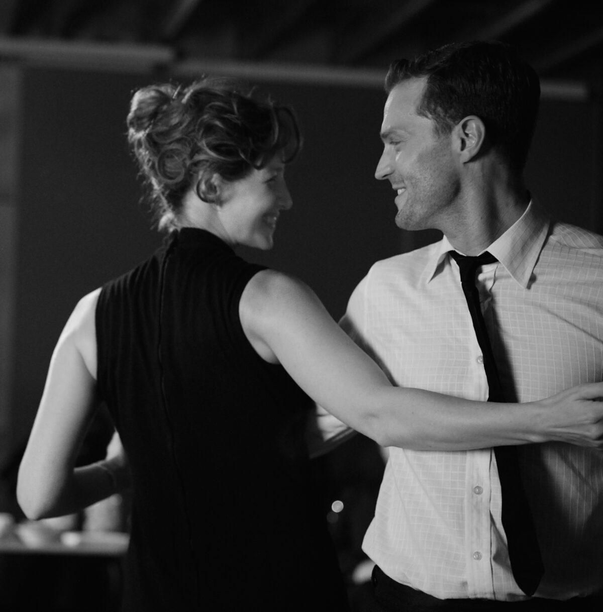 Ma (Catriona Balfe) and Pa (Jamie Dornan) dance at a party, in “Belfast.” (Rob Youngson/Focus Features)