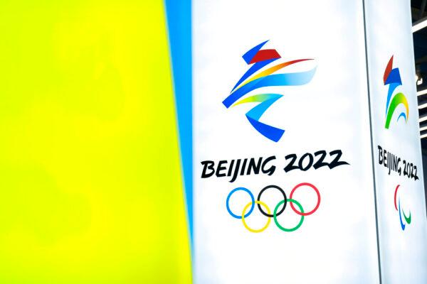 The logos for the 2022 Beijing Winter Olympics and Paralympics are seen during an exhibit at a visitors center at the Winter Olympic venues in Yanqing on the outskirts of Beijing, Feb. 5, 2021. (Mark Schiefelbein/AP Photo)