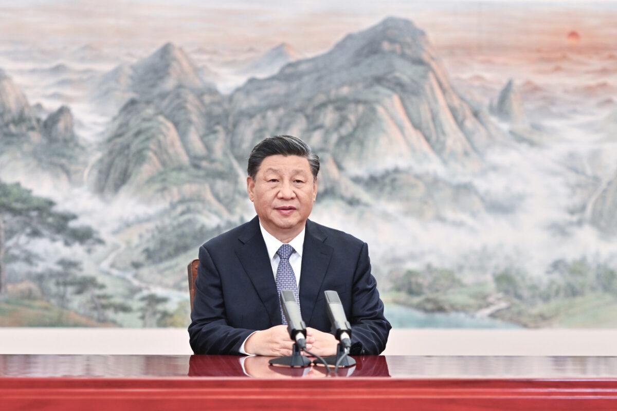 Chinese leader Xi Jinping delivers a keynote speech for the Asia–Pacific Economic Cooperation CEO Summit via video, from Beijing on Nov. 11, 2021. (Li Xueren/Xinhua via AP)