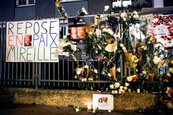 Flowers and placards are displayed outside Mireille Knoll's apartment during a silent march in Paris, on March 28, 2018. (Thibault Camus/AP Photo file)