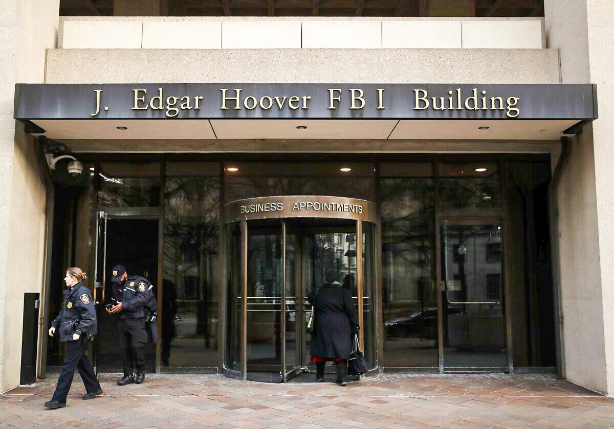 Law enforcement officers walk out of the J. Edgar Hoover FBI Building in Washington on Jan. 28, 2019. (Mark Wilson/Getty Images)