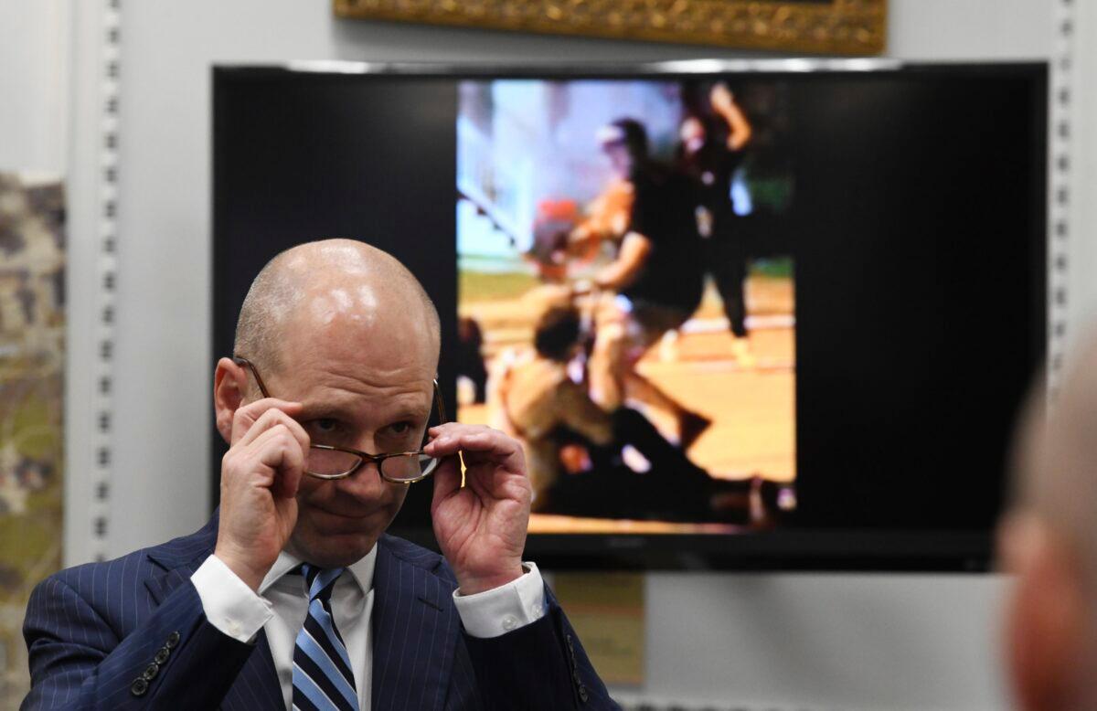Defense attorney Corey Chirafisi cross-examines Gaige Grosskreutz, who's shown on the video monitor being shot by Kyle Rittenhouse, during Rittenhouse's trial at the Kenosha County Courthouse in Kenosha, Wis., on Nov. 8, 2021. (Mark Hertzberg/Pool via AP)