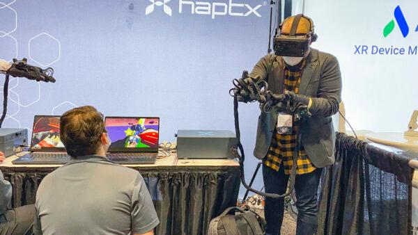 Gloves from Haptx Inc. that allow users to feel like they are interacting with a virtual object, at AWE USA at the Santa Clara Convention Center in California on Nov. 10, 2021. (Ilene Eng/The Epoch Times)