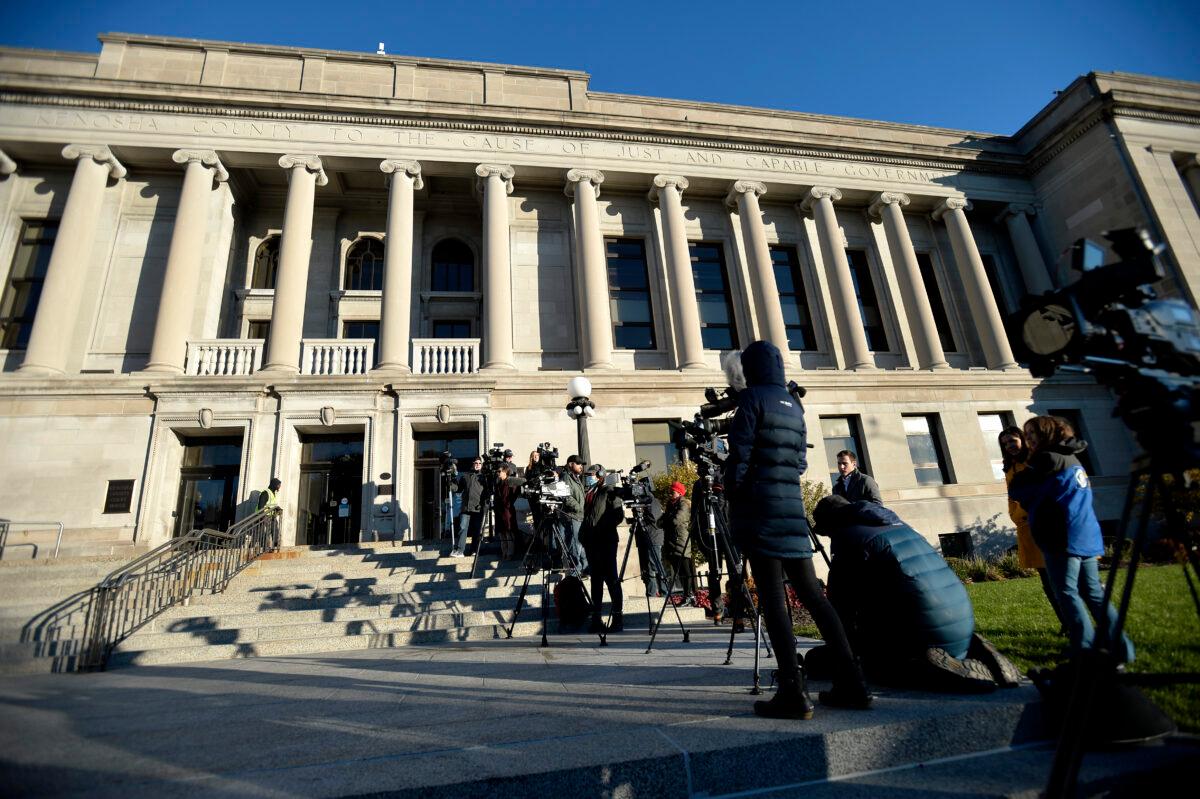 Reporters are seen outside the Kenosha County Courthouse in Kenosha, Wis., on Nov. 2, 2021. (Sean Krajacic/Pool/Getty Images)
