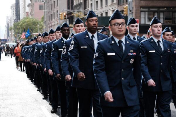 Military, police, high school bands, and others march in the Veterans Day Parade in New York City, on Nov. 11, 2021. (Spencer Platt/Getty Images)