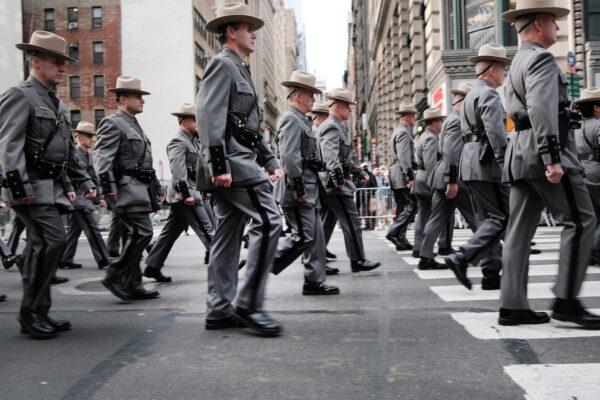 Military, police, high school bands, and others march in the Veterans Day Parade in New York City, on Nov. 11, 2021. (Spencer Platt/Getty Images)