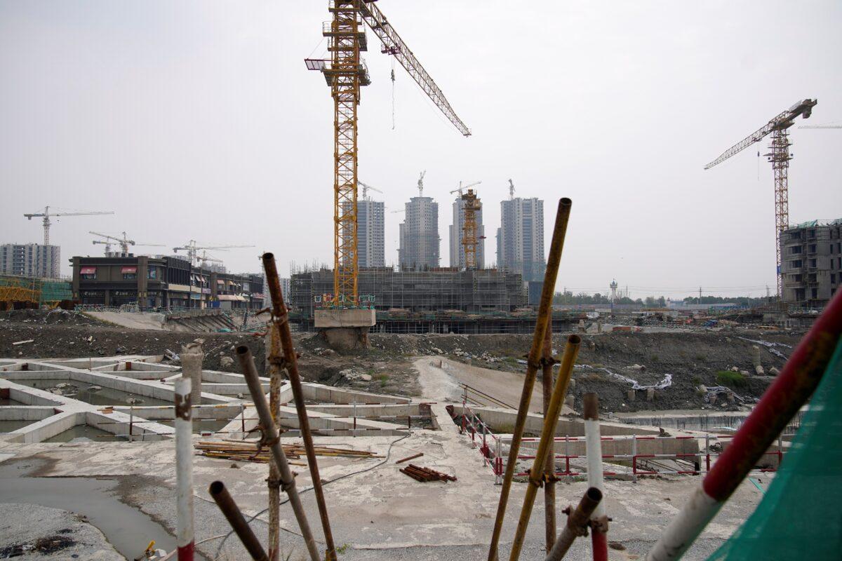 A crane stands at the construction site of Evergrande Cultural Tourism City, a China Evergrande Group project whose construction has halted in Suzhou's Taicang, Jiangsu Province, China, on Oct. 22, 2021. (Aly Song/Reuters)