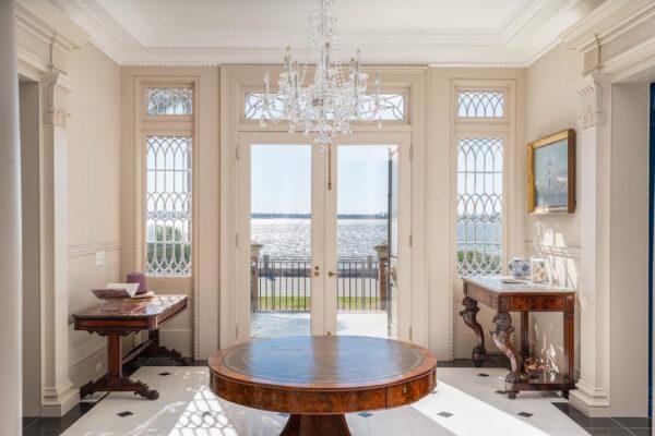 The entrance foyer looks out onto the Low Battery and the Ashley River, which borders the Charleston peninsula. C. Bissell Jenkins was the developer of this part of the city, with his house being the first built here. (Courtesy of Ellis Creek Photography)