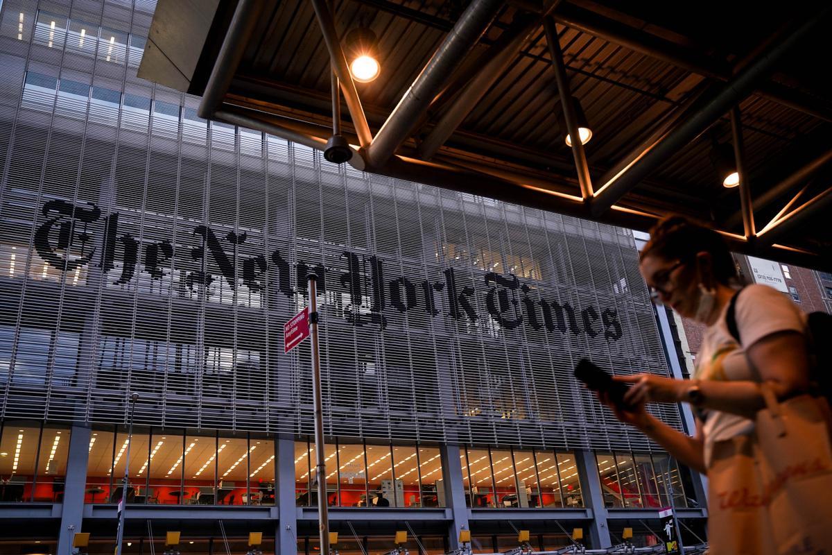 A woman walks past the New York Times building in New York City on Aug. 31, 2021. (Samira Bouaou/The Epoch Times)
