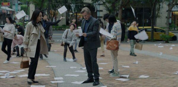 Min (Anastasia Lin) and journalist Daniel Davis (Sam Trammell), who senses something is not quite right in the government propaganda about Falun Gong, in “Unsilenced.” (Flying Cloud Productions)