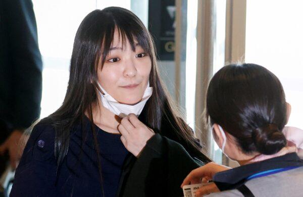 Mako Komuro, former Japan's Princess Mako and the eldest daughter of Crown Prince Akishino and Crown Princess Kiko, is seen before she and her newly married husband Kei board a flight bound for New York, at Haneda airport in Tokyo, Japan, on Nov. 14, 2021. (Issei Kato/Reuters)