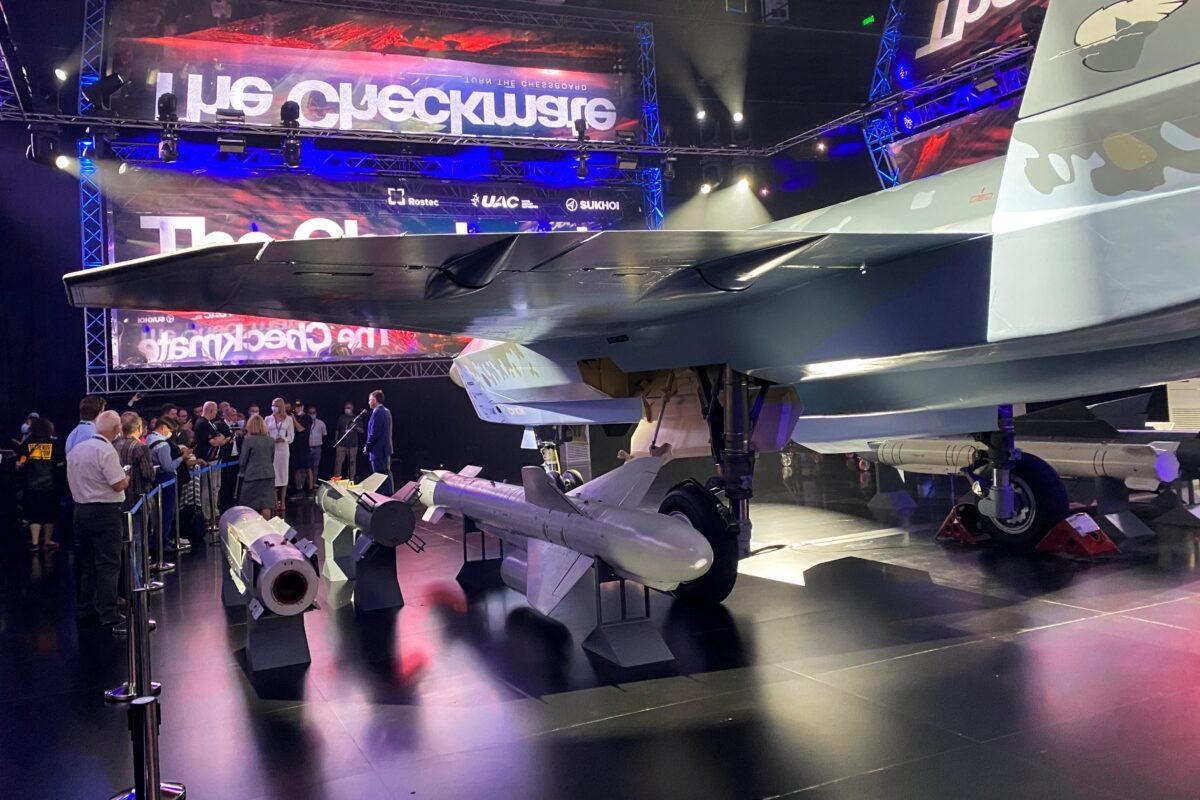 Yuri Slusar, head of United Aircraft Corporation, talks to media in front of a Sukhoi Su-75 Checkmate prototype warplane during the Dubai Airshow, in Dubai, United Arab Emirates, on Nov. 14, 2021. (Imad Creidi/Reuters)